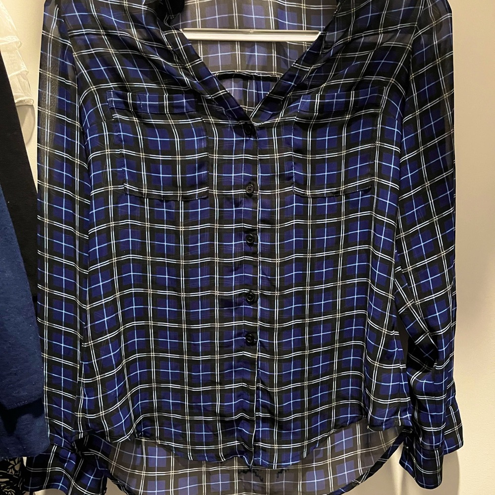 A woman’s plaid print blouse.